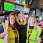 Superbowl event depicting 3 women and raffle tickets