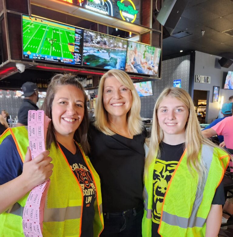 Superbowl event depicting 3 women and raffle tickets