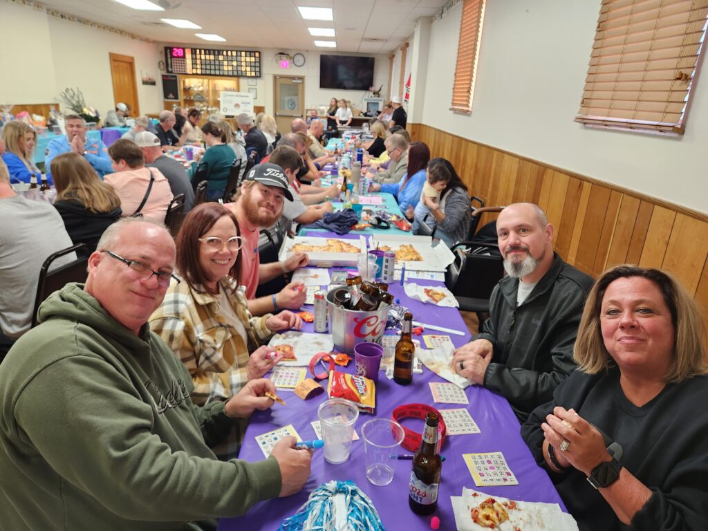 Numerous happy attendees playing bingo